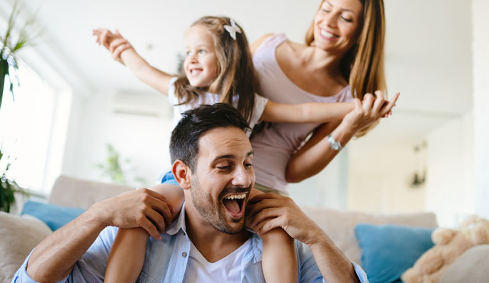 a happy family enjoying healthy indoor air