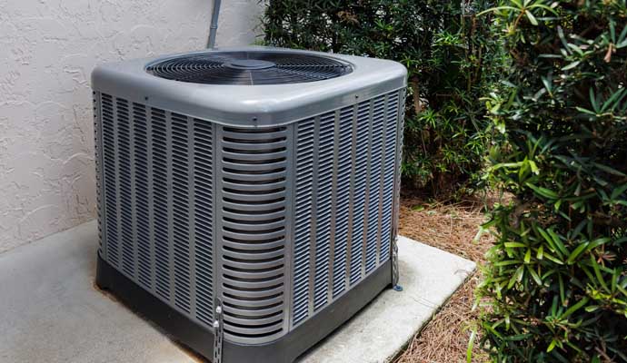 part of a central air conditioning system beside a building