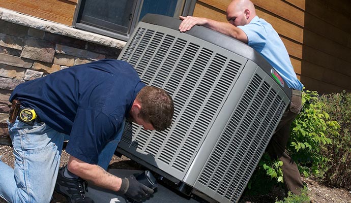 Professional worker installing AC