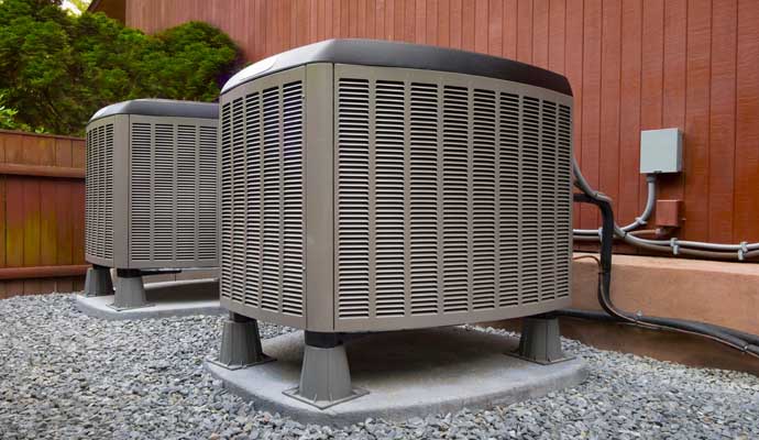 two large commercial air conditioning units installed outside a building