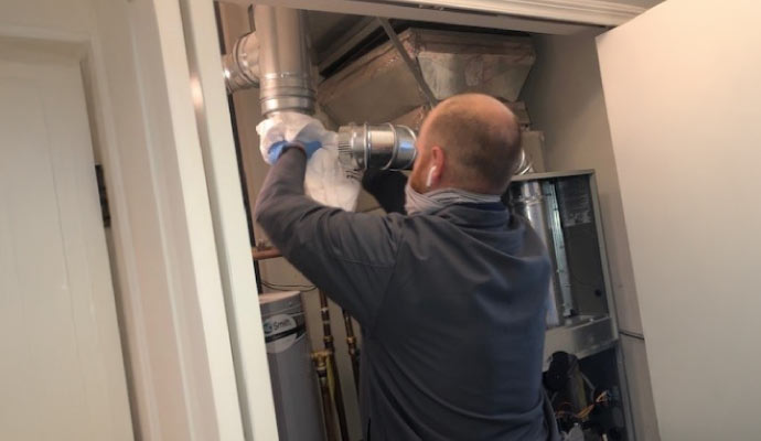 professional worker maintaining a heating system