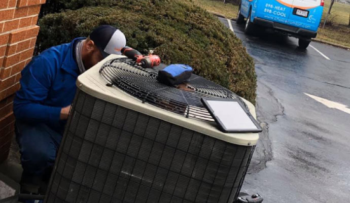 professional worker maintaining HVAC system