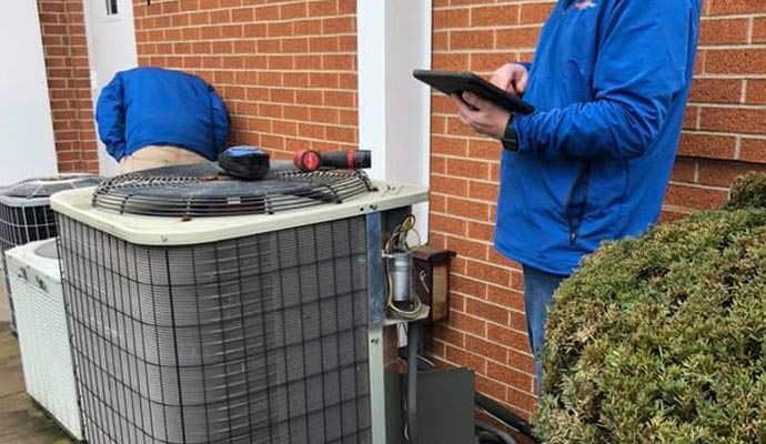 Professional worker servicing a HVAC system