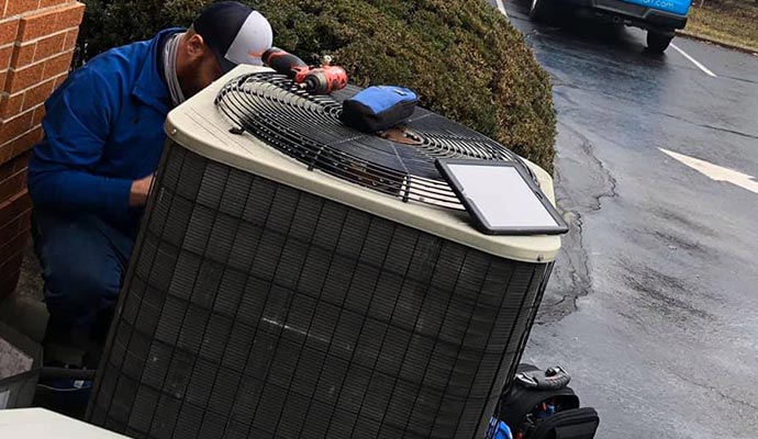 Professional worker repairing HVAC