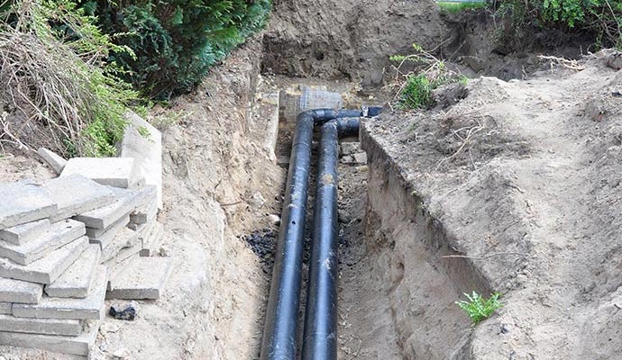 A pipe is being installed underground.