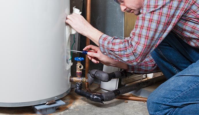 expert technician repairing water storage tanks