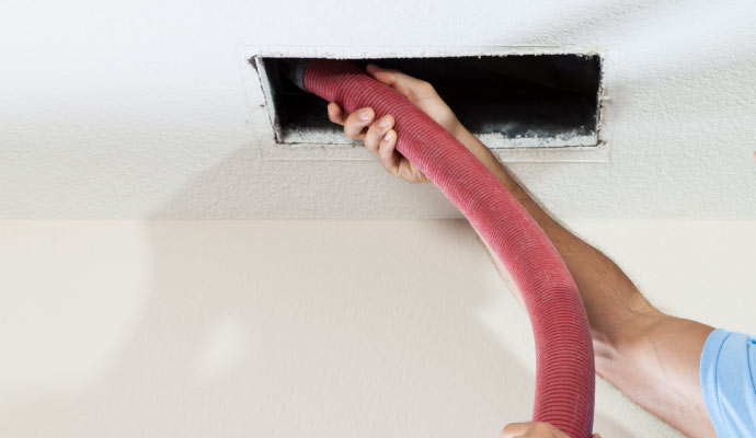 professional worker cleaning duct