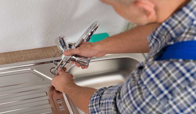 Professional installing a new kitchen sink