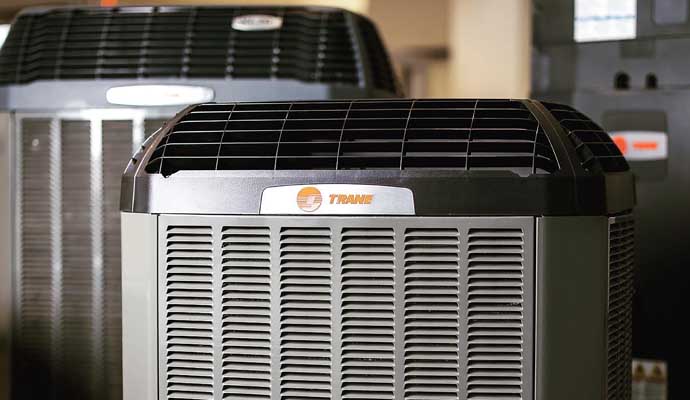 an outdoor HVAC unit from the brand Trane